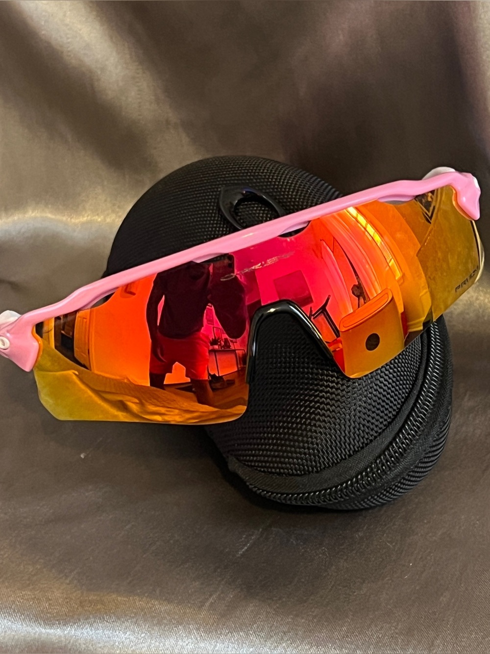 Oakley Pink Frame Sunglasses with Red-Orange Mirrored Lens